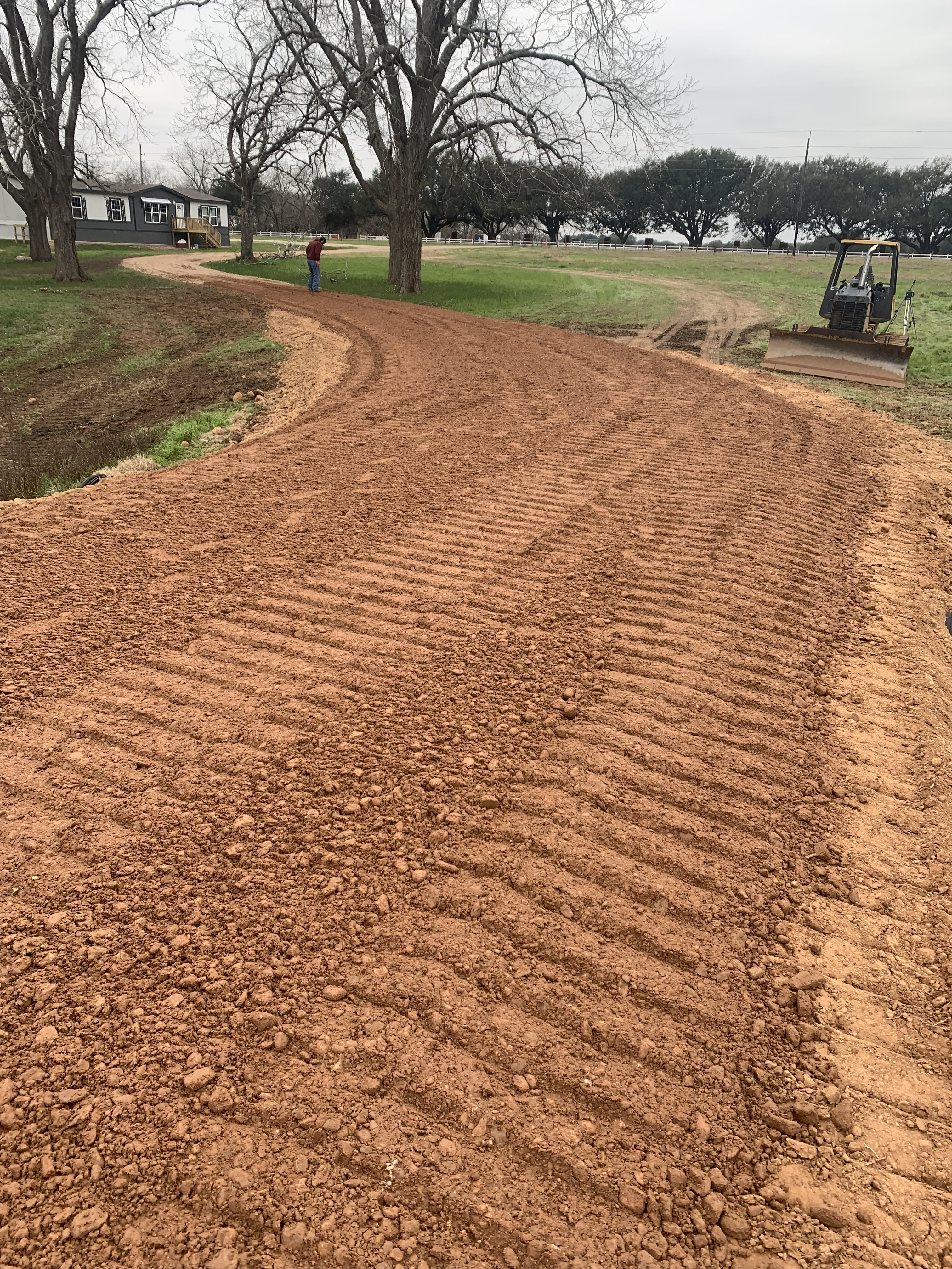 Newly installed gravel driveway with excellent drainage.