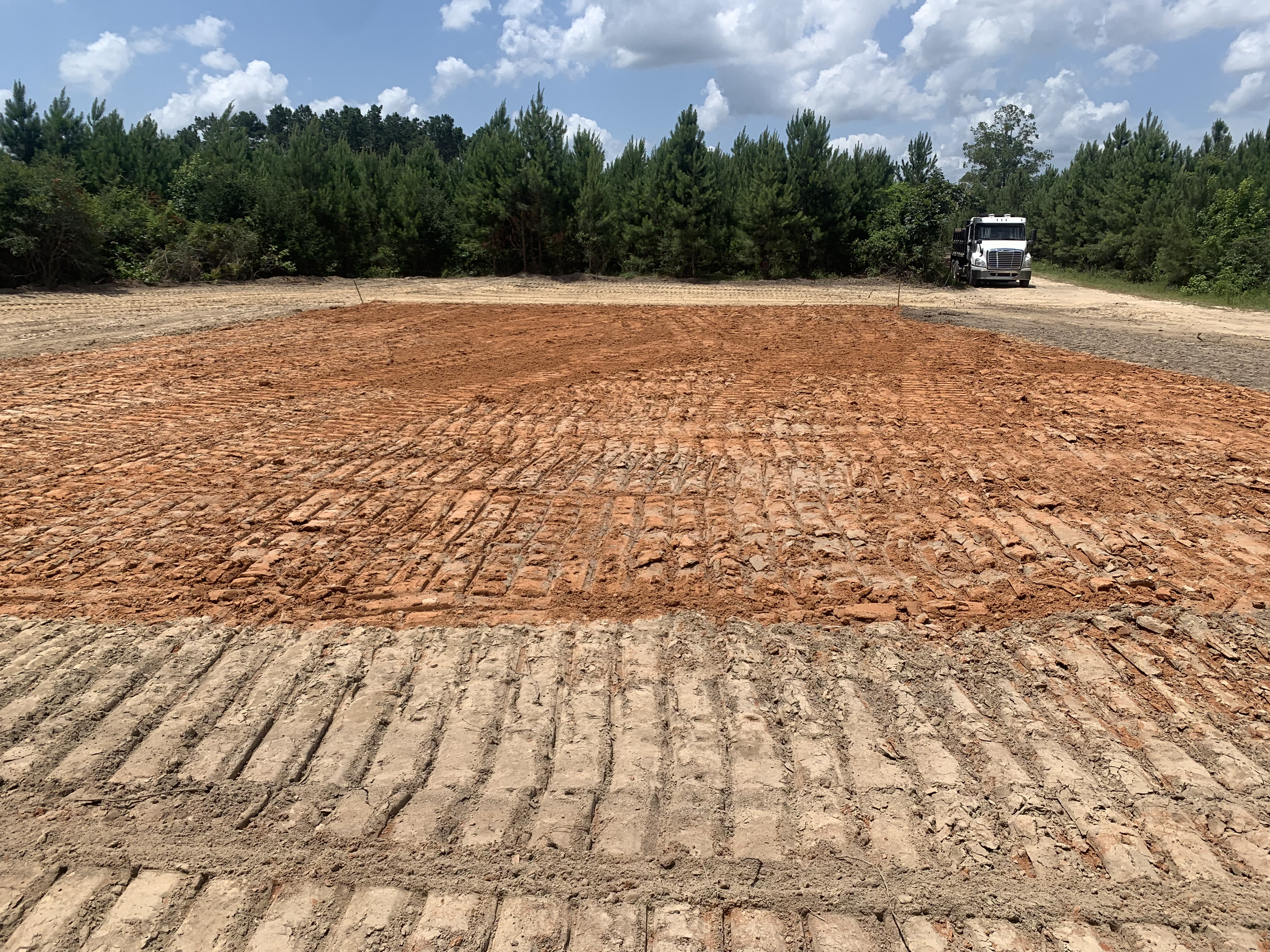 Completed house pad for new construction, showing level grading and preparation.